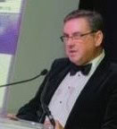 Photo of Andrew Thomas giving a keynote speach